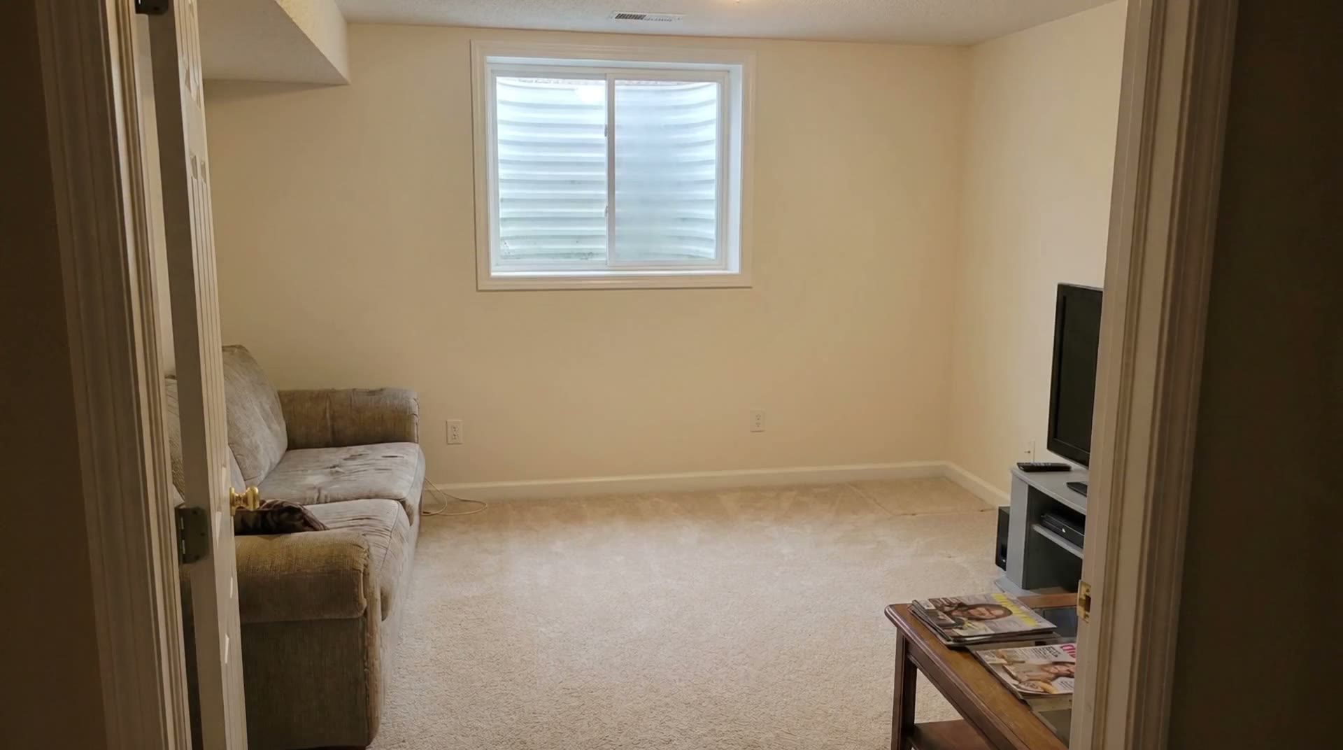 After: repaired and repainted wall, furniture back
